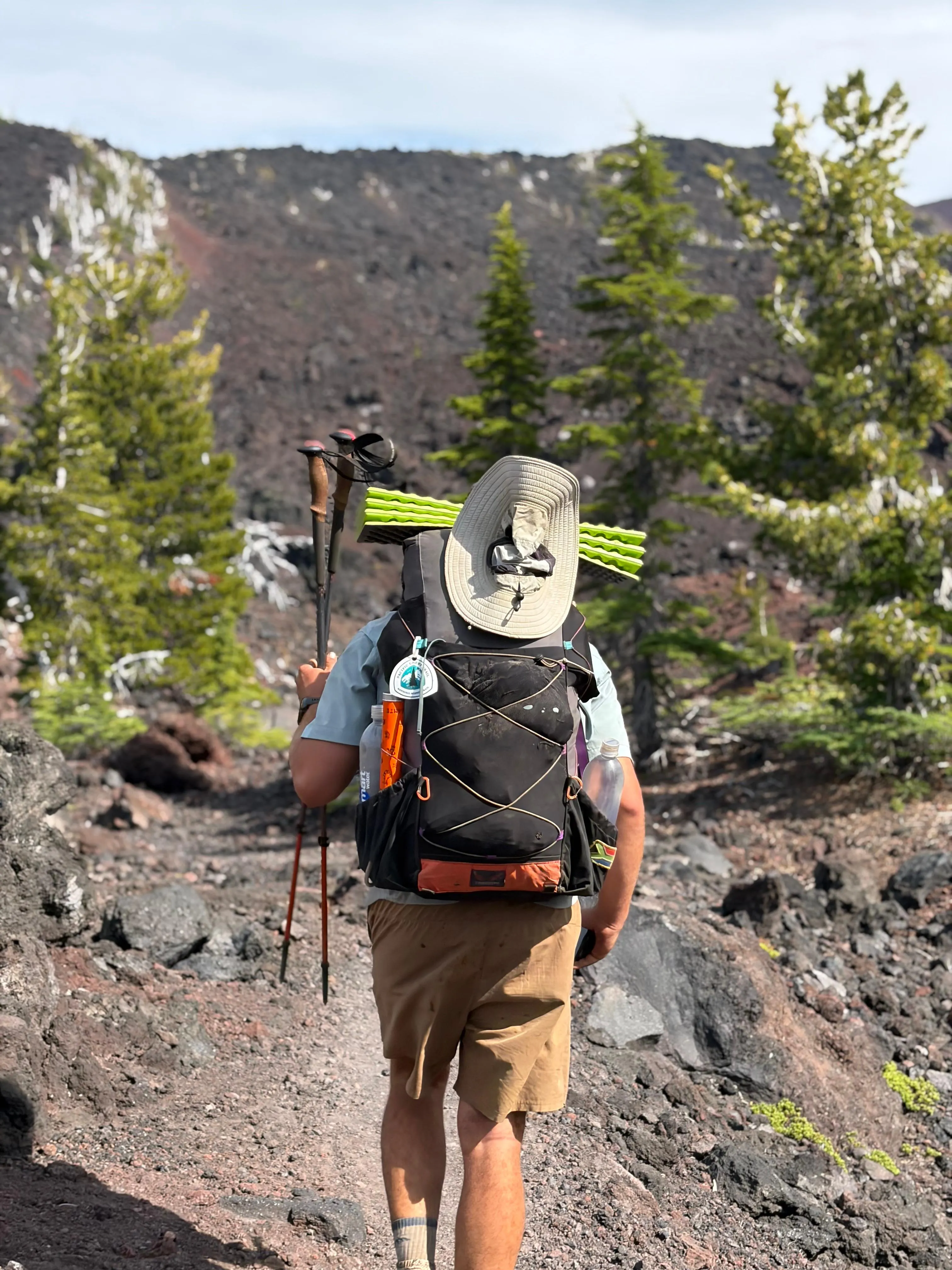 Neil hiking through a lava field in Oregon