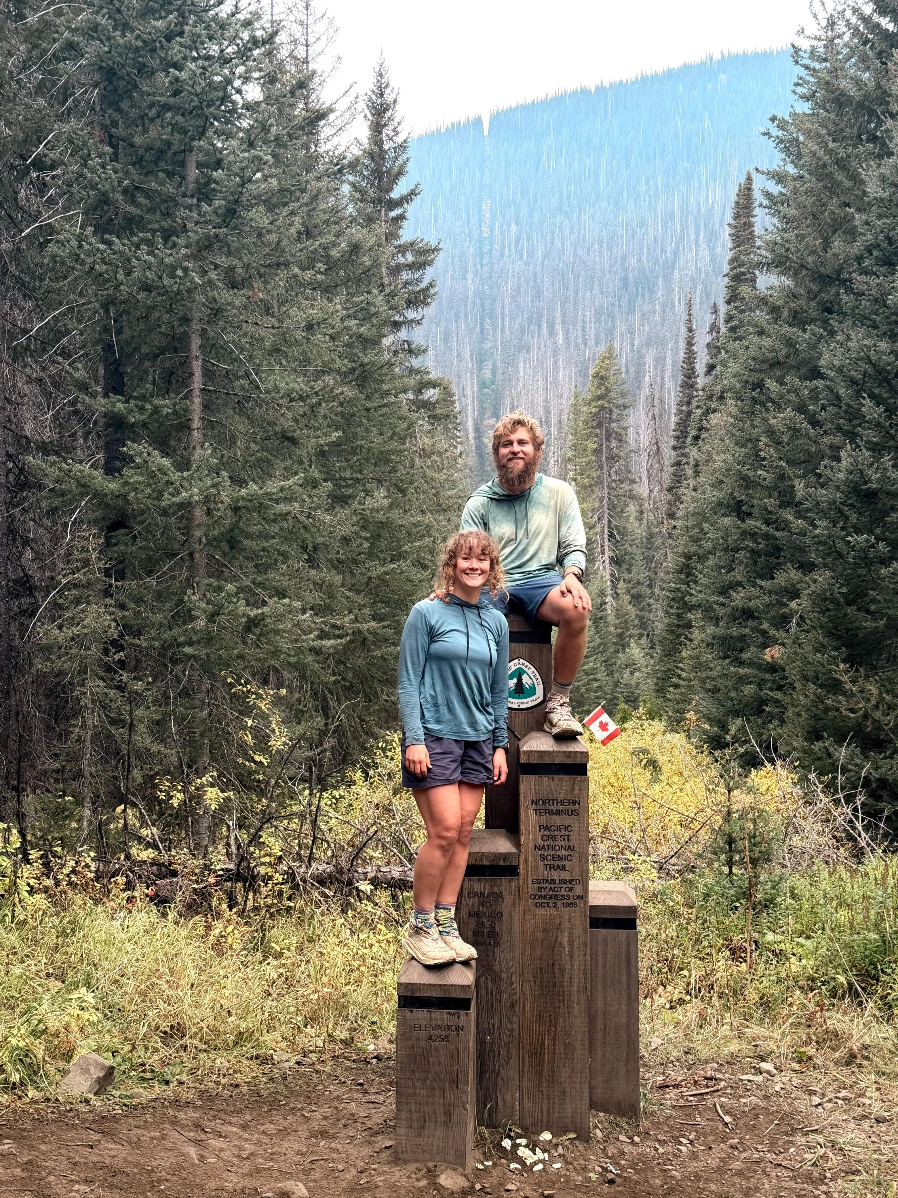 Neil and his fiancée at the Northern Terminus monument on the Canadian border